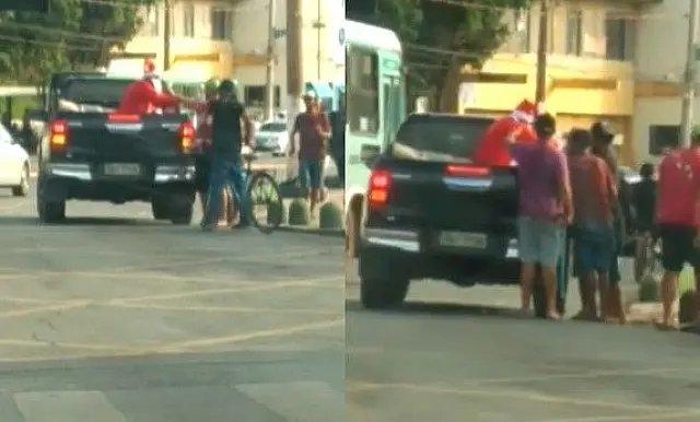 Papai Noel é flagrado distribuindo corotes para moradores de rua