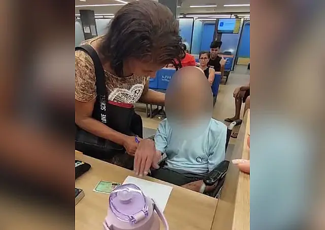 Mulher que levou morto a banco tem prisão convertida em preventiva